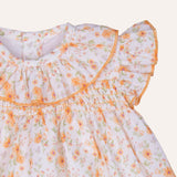 Jesusito engomado flores naranjas.